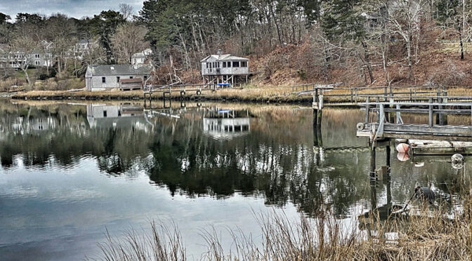 Dramatic Reflection On Arey’s Pond On Cape Cod.